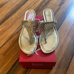 gold IMPO sandals.
